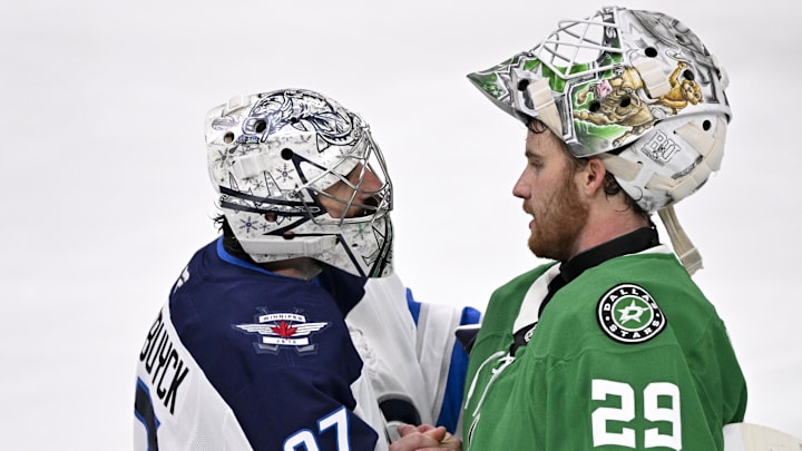 May 17, 2025; Dallas, Texas, USA; Winnipeg Jets goaltender Connor Hellebuyck (37) shakes hands with Dallas Stars goaltender Jake Oettinger (29) after the Stars defeat the Jets in the overtime period in game six of the second round of the 2025 Stanley Cup Playoffs at American Airlines Center. Mandatory Credit: Jerome Miron-Imagn Images