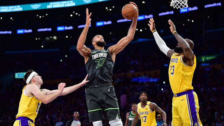 Minnesota Timberwolves center Rudy Gobert gets the rebound against Los Angeles Lakers guard Austin Reaves, left, and forward LeBron James during the second half in Game 5 of their first-round playoff series at Crypto.com Arena in Los Angeles on April 30, 2025. Minnesota Timberwolves center Rudy Gobert gets the rebound against Los Angeles Lakers guard Austin Reaves, left, and forward LeBron James during the second half in Game 5 of their first-round playoff series at Crypto.com Arena in Los Angeles on April 30, 2025.