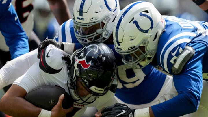 Indianapolis Colts defensive end Dayo Odeyingbo (54) sacks Houston Texans quarterback C.J. Stroud (7) on Sunday, Sept. 8, 2024, during a game against the Houston Texans at Lucas Oil Stadium in Indianapolis.