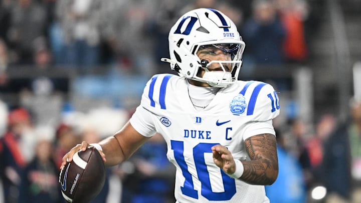 Dec 6, 2025; Charlotte, NC, USA; Duke Blue Devils quarterback Darian Mensah (10) looks to throw in the second quarter against the Virginia Cavaliers during the 2025 ACC Championship game at Bank of America Stadium. Mandatory Credit: Bob Donnan-Imagn Images