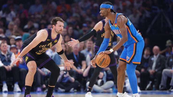 Apr 2, 2026; Oklahoma City, Oklahoma, USA; Oklahoma City Thunder guard Shai Gilgeous-Alexander (2) dribbles as Los Angeles Lakers guard Luka Doncic (77) defends during the first quarter at Paycom Center. Mandatory Credit: Alonzo Adams-Imagn Images
