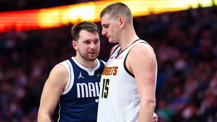Mar 17, 2024; Dallas, Texas, USA; Dallas Mavericks guard Luka Doncic (77) speaks with Denver Nuggets center Nikola Jokic (15) during the second half at American Airlines Center. Mandatory Credit: Kevin Jairaj-Imagn Images Mar 17, 2024; Dallas, Texas, USA; Dallas Mavericks guard Luka Doncic (77) speaks with Denver Nuggets center Nikola Jokic (15) during the second half at American Airlines Center. Mandatory Credit: Kevin Jairaj-Imagn Images