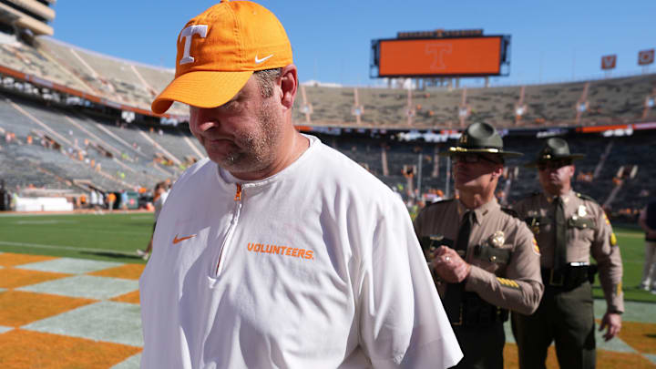 Tennessee football coach Josh Heupel walks off the field followed by his security detail after the win over UAB in an NCAA college football game on September 20, 2025, in Knoxville, Tennessee.