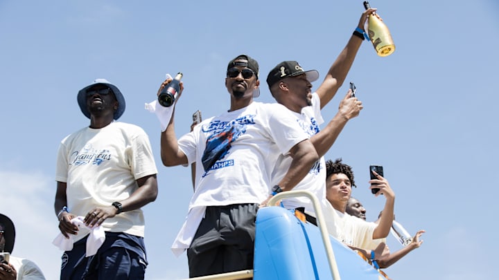 Jun 24, 2025; Oklahoma City, OK, USA; Oklahoma City Thunder players lift bottles during the 2025 NBA Oklahoma City Thunder championship parade. Mandatory Credit: Brett Rojo-Imagn Images Jun 24, 2025; Oklahoma City, OK, USA; Oklahoma City Thunder players lift bottles during the 2025 NBA Oklahoma City Thunder championship parade. Mandatory Credit: Brett Rojo-Imagn Images