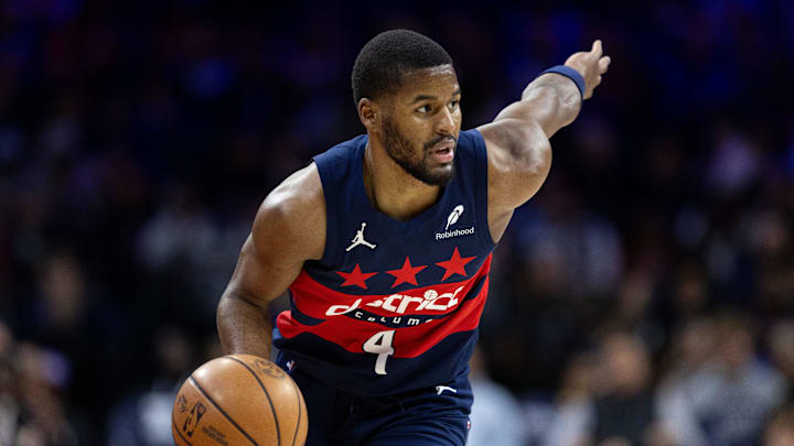 Jan 8, 2025; Philadelphia, Pennsylvania, USA; Washington Wizards guard Jared Butler (4) controls the ball against the Philadelphia 76ers during the second quarter at Wells Fargo Center. Mandatory Credit: Bill Streicher-Imagn Images