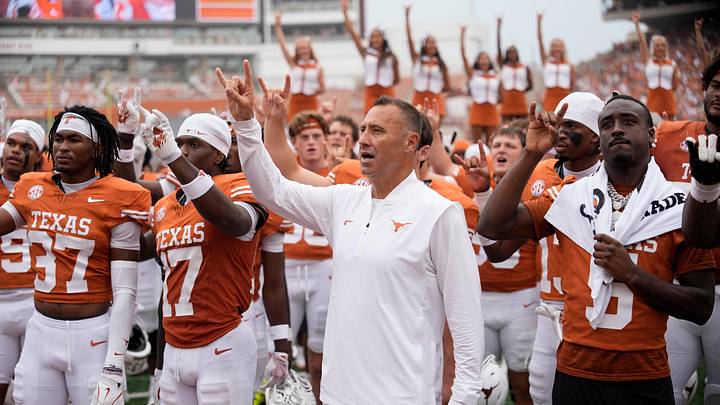 Texas Longhorns head coach Steve Sarkisian and players hold up their horns with the fans during the singing of the Eyes of Texas after a victory over the San Jose State Spartans at Darrell K Royal-Texas Memorial Stadium. Texas Longhorns head coach Steve Sarkisian and players hold up their horns with the fans during the singing of the Eyes of Texas after a victory over the San Jose State Spartans at Darrell K Royal-Texas Memorial Stadium.
