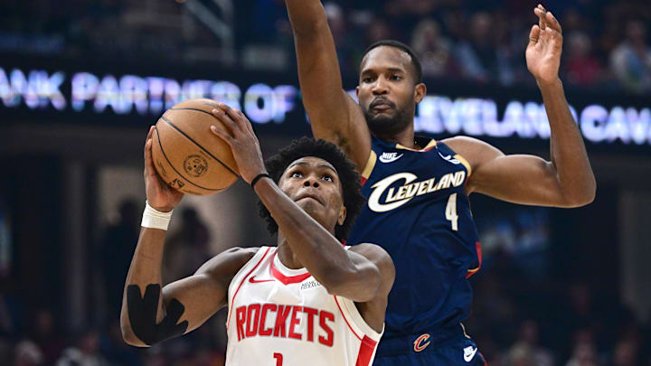 Nov 19, 2025; Cleveland, Ohio, USA; Houston Rockets guard Amen Thompson (1) goes to the basket against Cleveland Cavaliers center Evan Mobley (4) during the first half at Rocket Arena. Mandatory Credit: David Dermer-Imagn Images