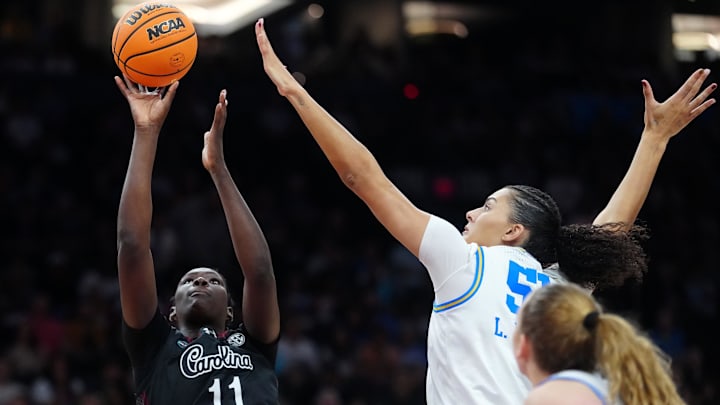 Apr 5, 2026; Phoenix, AZ, USA; South Carolina Gamecocks center Madina Okot (11) shoots against UCLA Bruins center Lauren Betts (51) in the second half during the National Championship game of the women's 2026 NCAA Tournament at Mortgage Matchup Center. Mandatory Credit: Kirby Lee-Imagn Images