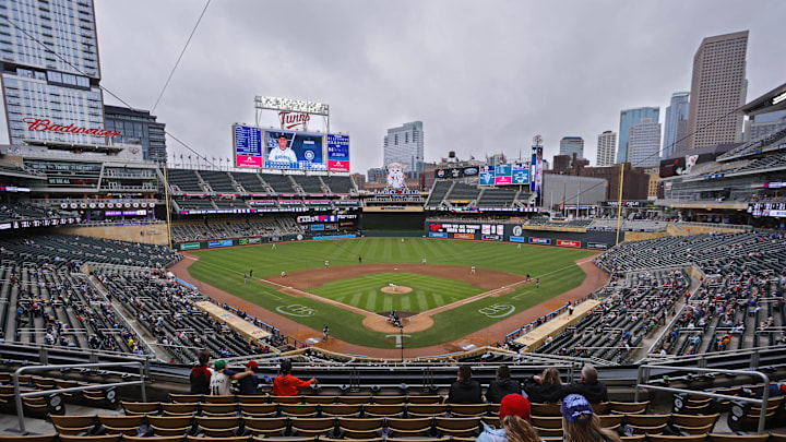 Jun 26, 2025; Minneapolis, Minnesota, USA; Sparsely seated fans watch the Seattle Mariners play the Minnesota Twins in the seventh inning after a nearly four and a half hour rain delay at Target Field. Mandatory Credit: Bruce Kluckhohn-Imagn Images