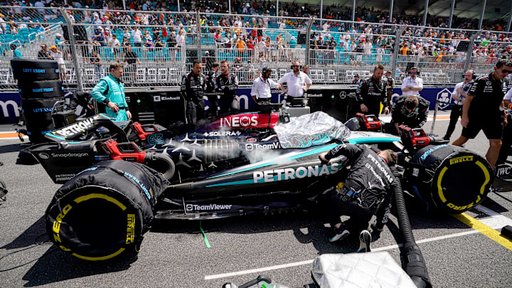 May 4, 2024; Miami Gardens, Florida, USA; Crewmembers of the Mercedes driver George Russell (63) cool the car on the grid before the F1 Sprint Race at Miami International Autodrome. Mandatory Credit: John David Mercer-Imagn Images