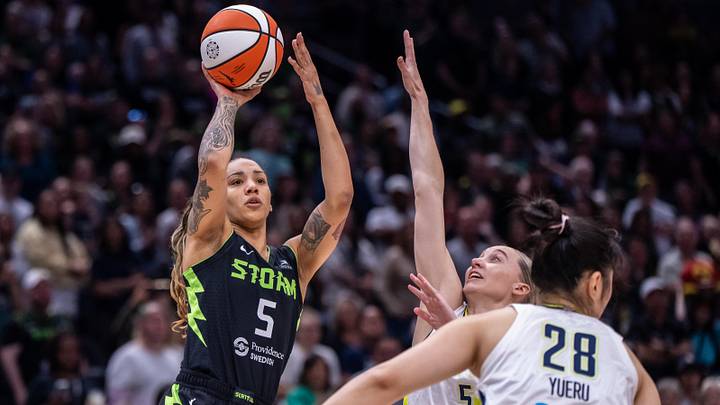 Jul 22, 2025; Seattle, Washington, USA; Seattle Storm forward Gabby Williams (5) shoots the ball against Dallas Wings guard Paige Bueckers (5) during the first half at Climate Pledge Arena. Jul 22, 2025; Seattle, Washington, USA; Seattle Storm forward Gabby Williams (5) shoots the ball against Dallas Wings guard Paige Bueckers (5) during the first half at Climate Pledge Arena.