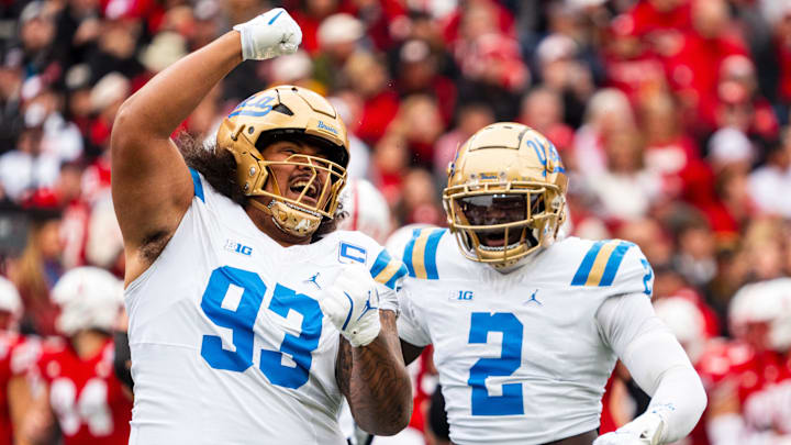 UCLA Bruins DT Jay Toia and LB Oluwafemi Oladejo celebrate after a sack against the Nebraska Cornhuskers.