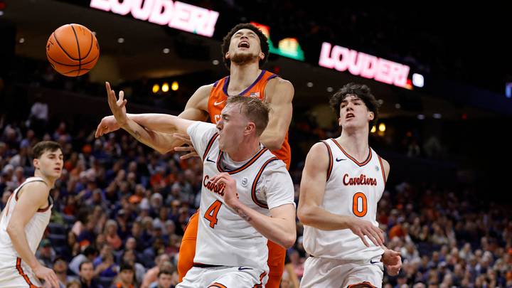 Mar 1, 2025; Charlottesville, Virginia, USA; Virginia Cavaliers guard Andrew Rohde (4) knocks the ball away from Clemson Tigers guard Chase Hunter (1) during the first half at John Paul Jones Arena. Mandatory Credit: Amber Searls-Imagn Images Mar 1, 2025; Charlottesville, Virginia, USA; Virginia Cavaliers guard Andrew Rohde (4) knocks the ball away from Clemson Tigers guard Chase Hunter (1) during the first half at John Paul Jones Arena. Mandatory Credit: Amber Searls-Imagn Images