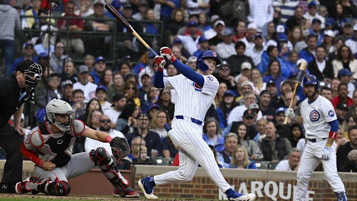 Chicago Cubs outfielder Pete Crow-Armstrong hits an RBI single against the Cincinnati Reds at Wrigley Field. 