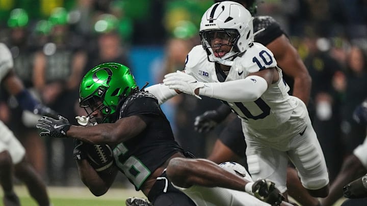 Oregon Ducks running back Noah Whittington (6) is brought down by Penn State Nittany Lions safety Dejuan Lane (10)