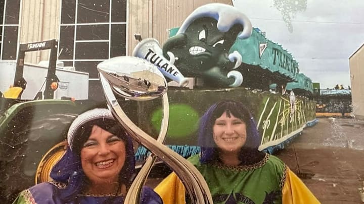 Lara Perrault and her Daughter with the Cotton Bowl Trophy at the Krewe of Themis parade Lara Perrault and her Daughter with the Cotton Bowl Trophy at the Krewe of Themis parade