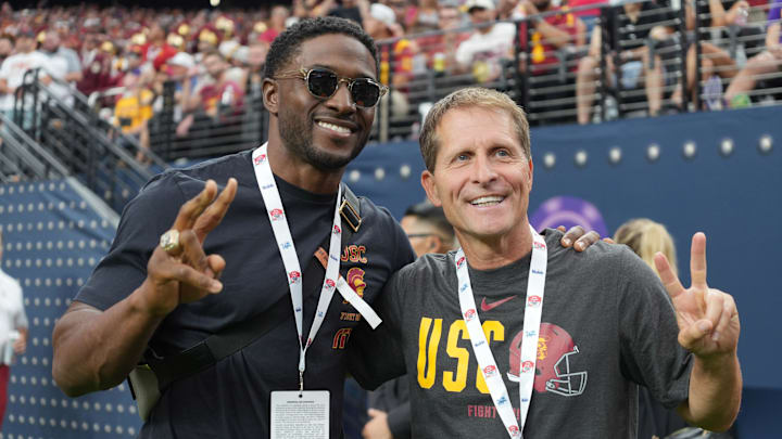 Sep 1, 2024; Paradise, Nevada, USA; Southern California Trojans running back Reggie Bush (left) and basketball coach Eric Musselman pose during the game against the LSU Tigers at Allegiant Stadium. Mandatory Credit: Kirby Lee-Imagn Images