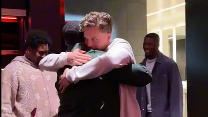 Joe Burrow hugs Ja’Marr Chase in the locker room.