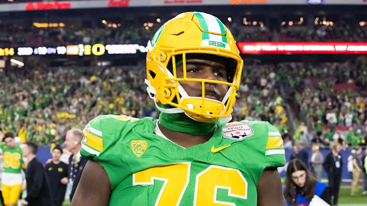 Jan 1, 2024; Glendale, AZ, USA; Oregon Ducks offensive lineman Josh Conerly Jr. (76) against the Liberty Flames during the 2024 Fiesta Bowl at State Farm Stadium. Mandatory Credit: Mark J. Rebilas-Imagn Images