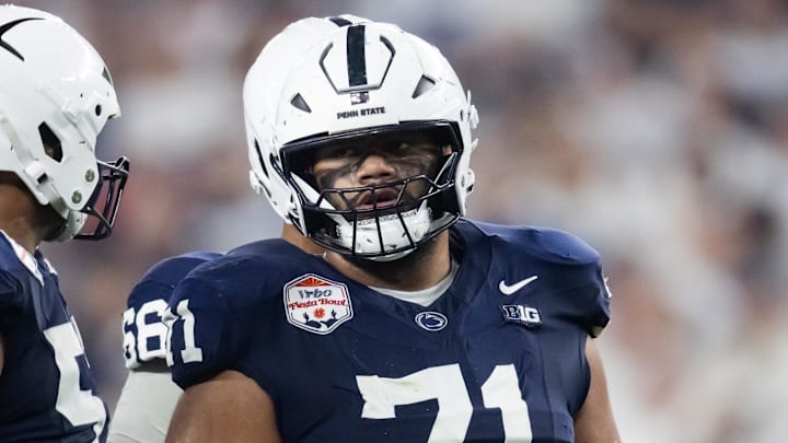 Dec 31, 2024; Glendale, AZ, USA; Penn State Nittany Lions offensive lineman Olaivavega Ioane (71) against the Boise State Broncos during the Fiesta Bowl at State Farm Stadium. Mandatory Credit: Mark J. Rebilas-Imagn Images