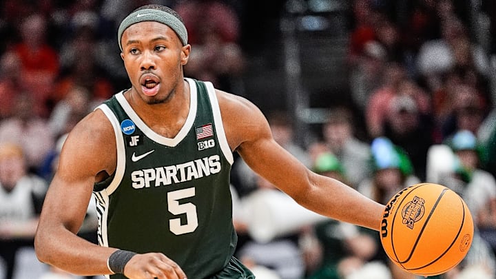 Michigan State guard Tre Holloman (5) looks to pass against Auburn during the first half of the Elite Eight round of NCAA tournament at State Farm Arena in Atlanta, Ga. on Sunday, March 30, 2025.
