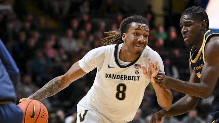 Dec 29, 2025; Nashville, Tennessee, USA;  Vanderbilt Commodores guard Tyler Harris (8) drives to the basket against the New Haven Chargers during the first half at Memorial Gymnasium. Mandatory Credit: Steve Roberts-Imagn Images