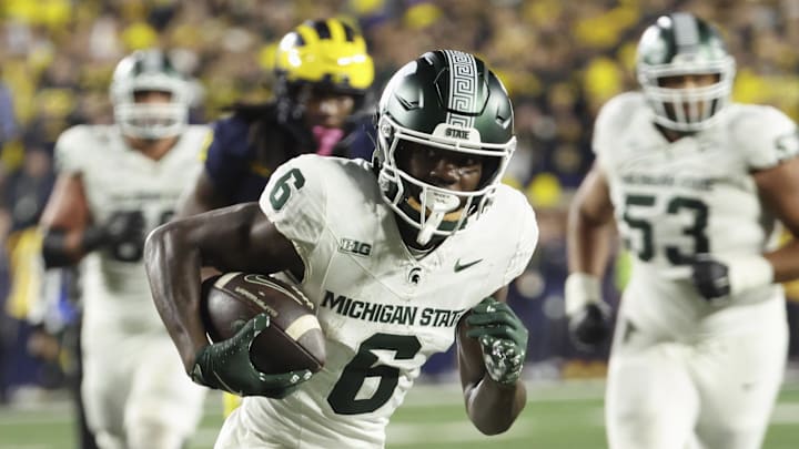 Oct 26, 2024; Ann Arbor, Michigan, USA;  Michigan State Spartans wide receiver Nick Marsh (6) runs the ball against the Michigan Wolverines at Michigan Stadium. Mandatory Credit: Rick Osentoski-Imagn Images