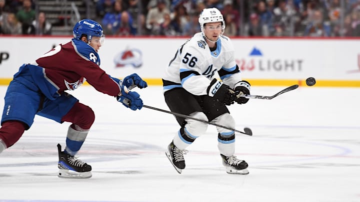 Sep 29, 2024; Denver, Colorado, USA; Utah Hockey Club forward Kailer Yamamoto (56) plays the ball into the offensive zone during the first period against the Colorado Avalanche at Ball Arena. Mandatory Credit: Christopher Hanewinckel-Imagn Images