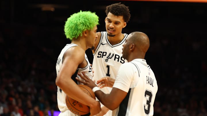 Dec 3, 2024; Phoenix, Arizona, USA; San Antonio Spurs forward Jeremy Sochan (10) with center Victor Wembanyama (1) and guard Chris Paul (3) against the Phoenix Suns during an NBA Cup game at Footprint Center. Dec 3, 2024; Phoenix, Arizona, USA; San Antonio Spurs forward Jeremy Sochan (10) with center Victor Wembanyama (1) and guard Chris Paul (3) against the Phoenix Suns during an NBA Cup game at Footprint Center.