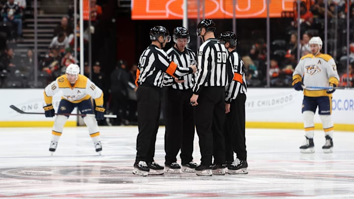 Mar 12, 2023; Anaheim, California, USA; NHL officials gather center ice before the game between the Anaheim Ducks and the Nashville Predators at Honda Center. Mandatory Credit: Kiyoshi Mio-Imagn Images Mar 12, 2023; Anaheim, California, USA; NHL officials gather center ice before the game between the Anaheim Ducks and the Nashville Predators at Honda Center. Mandatory Credit: Kiyoshi Mio-Imagn Images