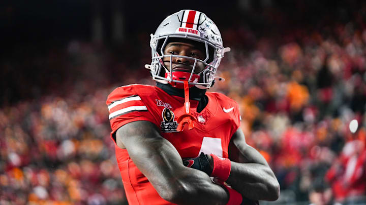 Ohio State Buckeyes wide receiver Jeremiah Smith (4) celebrates after scoring a touchdown against Tennessee Volunteers defensive back Rickey Gibson III (1) in the first half at Ohio Stadium on Saturday, Dec. 21, 2024 in Columbus, Ohio. Ohio State Buckeyes wide receiver Jeremiah Smith (4) celebrates after scoring a touchdown against Tennessee Volunteers defensive back Rickey Gibson III (1) in the first half at Ohio Stadium on Saturday, Dec. 21, 2024 in Columbus, Ohio.