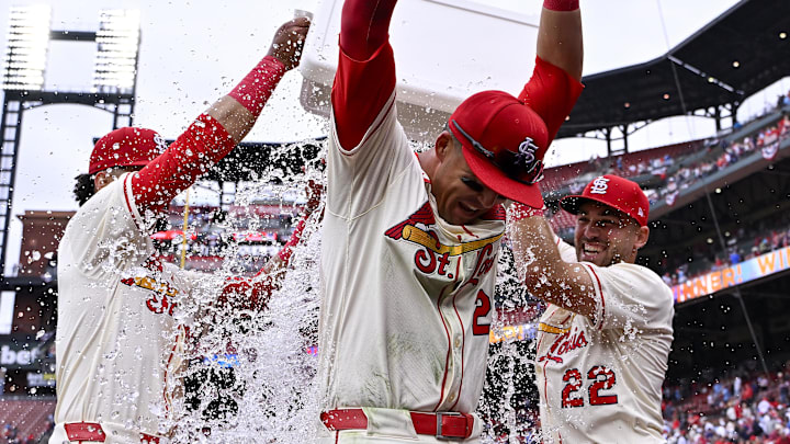 Mar 29, 2025; St. Louis, Missouri, USA; St. Louis Cardinals left fielder Lars Nootbaar (21) is doused with water by shortstop Masyn Winn (0) and center fielder Michael Siani (22) after the Cardinals defeated the Minnesota Twins at Busch Stadium. Mandatory Credit: Jeff Curry-Imagn Images Mar 29, 2025; St. Louis, Missouri, USA; St. Louis Cardinals left fielder Lars Nootbaar (21) is doused with water by shortstop Masyn Winn (0) and center fielder Michael Siani (22) after the Cardinals defeated the Minnesota Twins at Busch Stadium. Mandatory Credit: Jeff Curry-Imagn Images