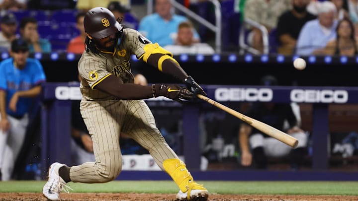Aug 11, 2024; Miami, Florida, USA; San Diego Padres catcher Luis Campusano (12) hits a single against the Miami Marlins during the sixth inning at loanDepot Park. Mandatory Credit: Sam Navarro-Imagn Images