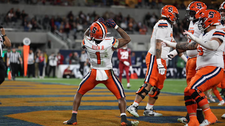 Dec 27, 2024; San Diego, CA, USA; Syracuse Orange running back LeQuint Allen (1) celebrates after scoring a touchdown against the Washington State Cougars during the first quarter at Snapdragon Stadium. Mandatory Credit: Abe Arredondo-Imagn Images Dec 27, 2024; San Diego, CA, USA; Syracuse Orange running back LeQuint Allen (1) celebrates after scoring a touchdown against the Washington State Cougars during the first quarter at Snapdragon Stadium. Mandatory Credit: Abe Arredondo-Imagn Images