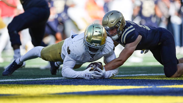 Oct 26, 2024; East Rutherford, New Jersey, USA; Notre Dame Fighting Irish linebacker Jaylen Sneed (3) recovers a fumble by Navy Midshipmen quarterback Blake Horvath (11) in the end zone for a defensive touchdown during the second half at MetLife Stadium. Mandatory Credit: Vincent Carchietta-Imagn Images