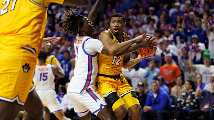Jan 14, 2025; Gainesville, Florida, USA; Florida Gators guard Denzel Aberdeen (11) defends Missouri Tigers guard Tony Perkins (12) during the first half at Exactech Arena at the Stephen C. O'Connell Center. Mandatory Credit: Matt Pendleton-Imagn Images