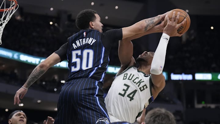 Mar 8, 2025; Milwaukee, Wisconsin, USA; Milwaukee Bucks forward Giannis Antetokounmpo (34) drives to the basket against Orlando Magic guard Cole Anthony (50) win the first half at Fiserv Forum. Mandatory Credit: Michael McLoone-Imagn Images