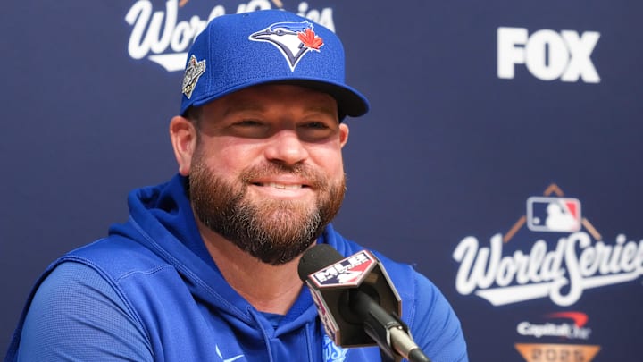 Oct 29, 2025; Los Angeles, California, USA; Toronto Blue Jays manager John Schneider (14) speaks at the pregame press conference before game five of the 2025 MLB World Series at Dodger Stadium. Oct 29, 2025; Los Angeles, California, USA; Toronto Blue Jays manager John Schneider (14) speaks at the pregame press conference before game five of the 2025 MLB World Series at Dodger Stadium.