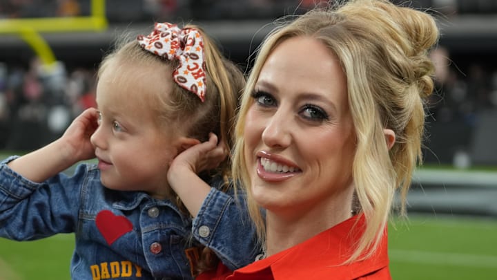 Brittany Mahomes, the wife of Kansas City Chiefs quarterback Patrick Mahomes (15) holds daughter Sterling Mahomes during the game against the Las Vegas Raiders at Allegiant Stadium.