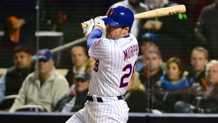 Oct 31, 2015; New York City, NY, USA; New York Mets second baseman Daniel Murphy hits a single against the Kansas City Royals in the 9th inning in game four of the World Series at Citi Field. Mandatory Credit: Jeff Curry-Imagn Images