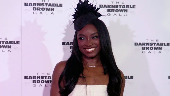 Olympian Simone Biles poses on the Barnstable Brown Derby Eve Gala red carpet Friday night. May 02, 2025 Olympian Simone Biles poses on the Barnstable Brown Derby Eve Gala red carpet Friday night. May 02, 2025