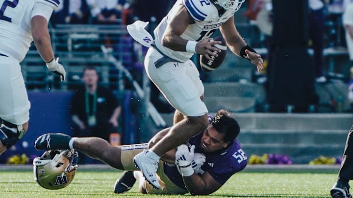 Voi Tunuufi loses his helmet as he picks up a sack against Northwestern.