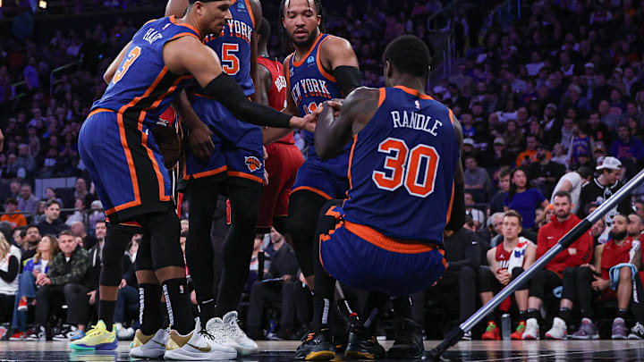 Jan 27, 2024; New York, New York, USA; New York Knicks forward Julius Randle (30) is helped up by