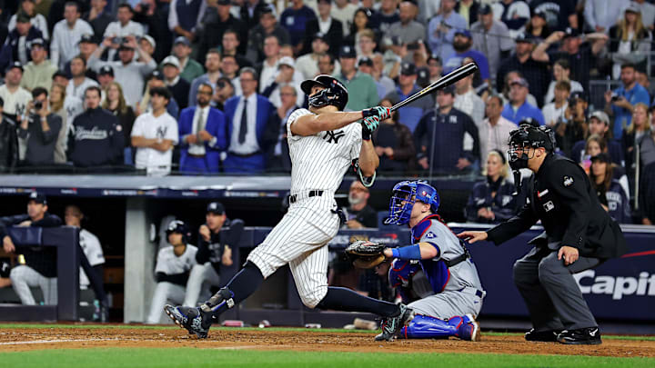 Oct 30, 2024; New York, New York, USA; New York Yankees designated hitter Giancarlo Stanton (27) hits an RBI sacrifice fly during the sixth inning against the Los Angeles Dodgers in game four of the 2024 MLB World Series at Yankee Stadium. Oct 30, 2024; New York, New York, USA; New York Yankees designated hitter Giancarlo Stanton (27) hits an RBI sacrifice fly during the sixth inning against the Los Angeles Dodgers in game four of the 2024 MLB World Series at Yankee Stadium.