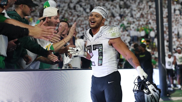 Then Oregon running back Jayden Limar (27) greets fans after beating Penn State on the road. 