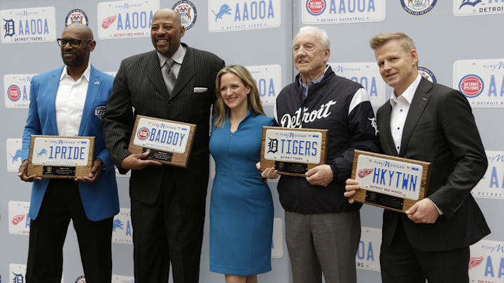 Former Detroit Lion, Herman Moore, left, stands with former Piston Earl Cureton, Tiger great Al Kaline, and Red Wing great Chris Osgood.
