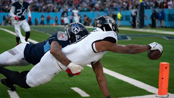 Jacksonville Jaguars wide receiver Zay Jones (7) is met by Tennessee Titans cornerback Sean