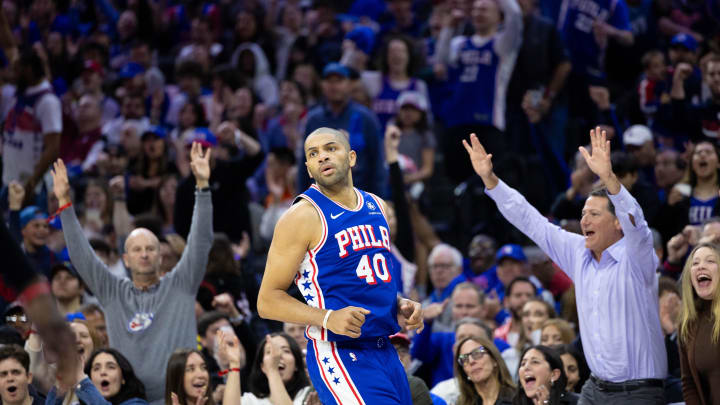 Apr 17, 2024; Philadelphia, Pennsylvania, USA; Fans react behind Philadelphia 76ers forward Nicolas