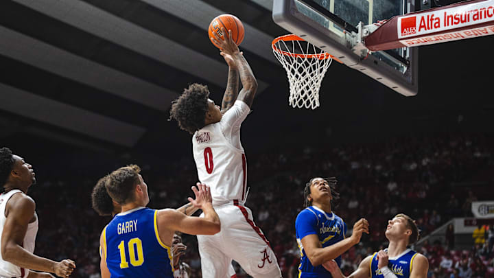 Dec 29, 2024; Tuscaloosa, Alabama, USA; Alabama Crimson Tide guard Labaron Philon (0) attempts a shot against the South Dakota State Jackrabbits during the first half at Coleman Coliseum. Mandatory Credit: Will McLelland-Imagn Images