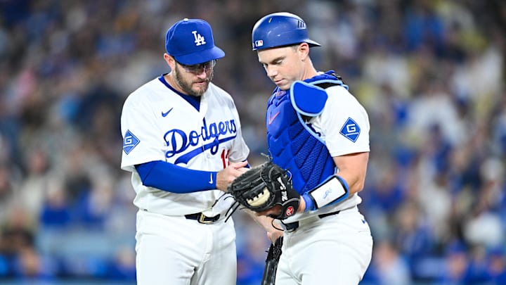 Apr 24, 2026; Los Angeles, California, USA; Los Angeles Dodgers third baseman Max Muncy (13) and Los Angeles Dodgers catcher Will Smith (16) react after colliding during the fourth inning against the Chicago Cubs at Dodger Stadium. Mandatory Credit: William Liang-Imagn Images